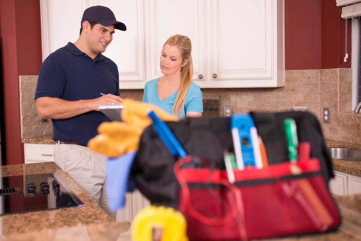 Repairman in customer's home.
